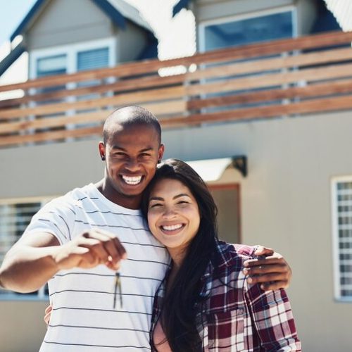 weve-secured-house-our-dreams-portrait-young-couple-holding-keys-their-new-home_590464-24028